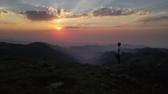 Man Watching Nature At Sunset alt