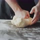 Baker Kneading Dough on Table - VideoHive Item for Sale