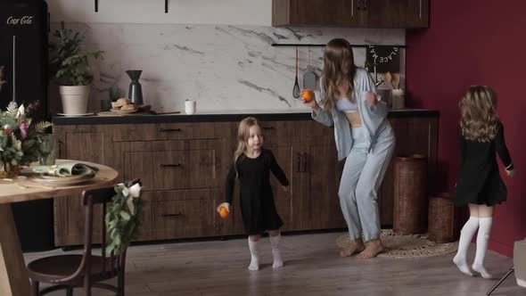 Dancing Young Mother Daughters Having Fun Festive Holidays Together Xmas Decorated Kitchen