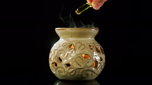 Dripping Oil Into Vase Closeup alt