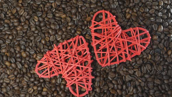 Two Red Hearts on a Heap of Coffee Grains