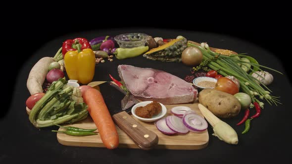 Assorted Vegetables, Spices, Fresh Fish Fillets And Fresh Fish Fillets Are Prepared For Cooking. alt