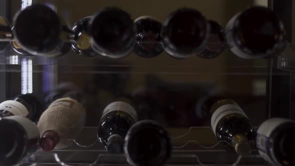 Stand with Bottles of Wine in the Restaurant. Stand with Wine Bottles Without Logos in the Frame alt