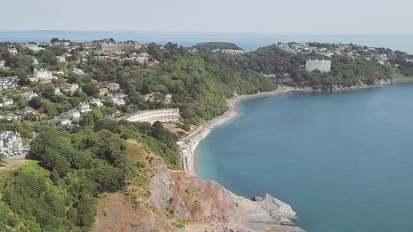 Aerial fly over of beautiful Coastline towards small town alt