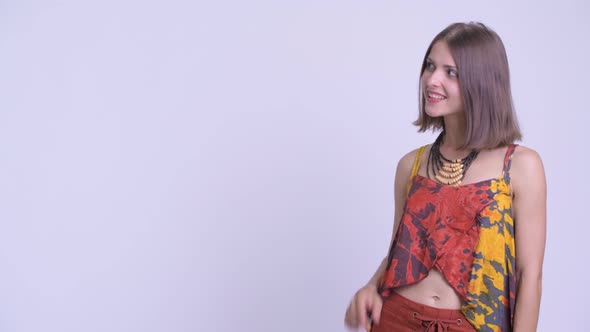 Happy Young Beautiful Hipster Woman Touching Something and Crossing Arms alt