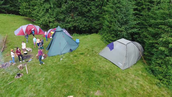 Aerial shot mountain forest with camp