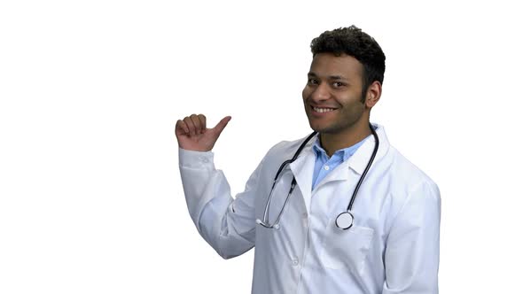 Smiling Doctor Pointing to Copy Space alt