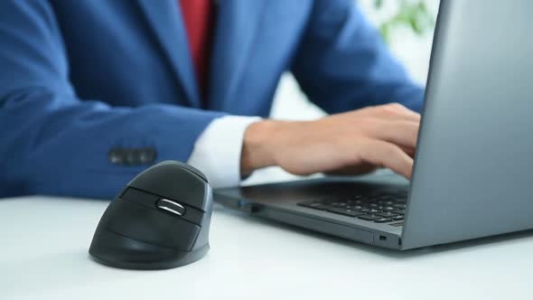Businessman In Office And Using Computer Mouse