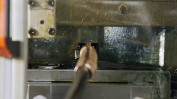 A large industrial punch press forming sheet metal parts alt