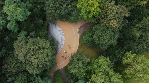 A Drone View From Above on a Round Area Surrounded By Dense Forest