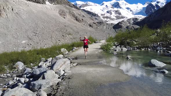 Woman in Morteratsch Glacier Running alt