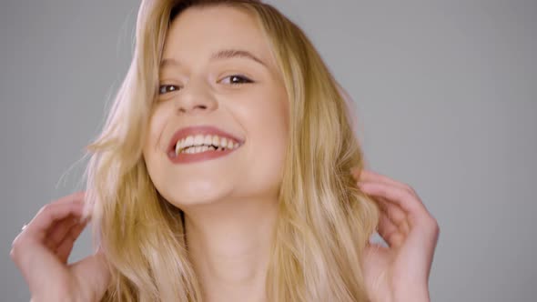 Pretty Blonde Female Having Fun and Making Face alt