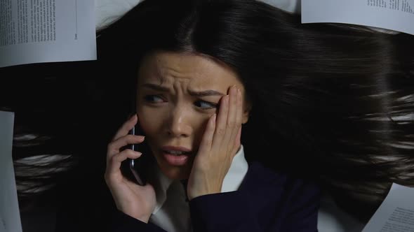 Nervous Female Manager Talking Phone and Biting Nails, Conversation With Boss alt