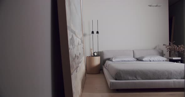 Bedroom in a Minimalist Apartment in White Tones with Modern Big Picture alt