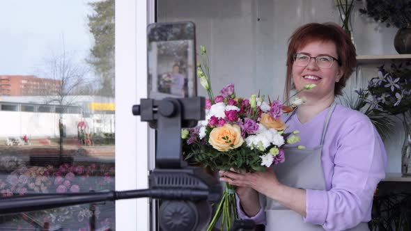 Florist blogger recording floristry video, conference calling