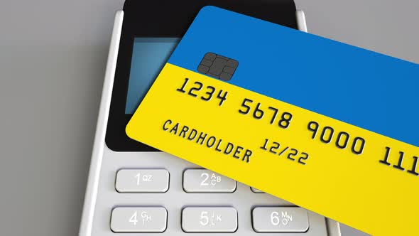 Payment Terminal with Credit Card Featuring Flag of Ukraine