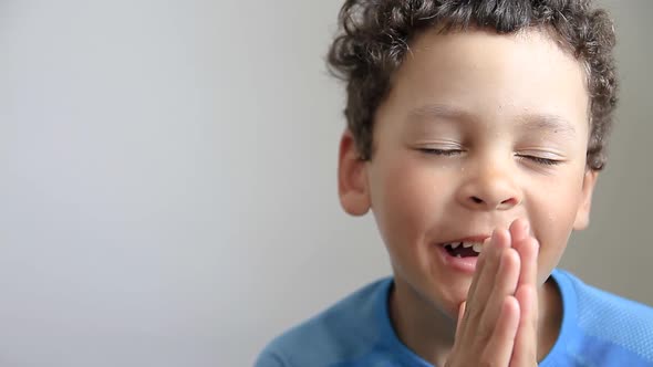 little boy praying to God with hands together stock video alt