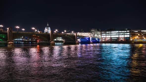 Illuminated Southwark Bridge at night with Saint Paul's cathedral in background, London, UK alt