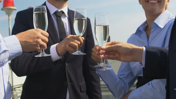 Business Partners Clinking Champagne Glasses, Celebrating Successful Contract