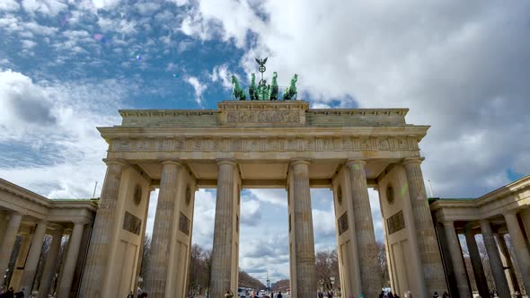 Timelapse Of Brandeburg Gate In A Sunny Day With Tourists And Clouds Passing By alt