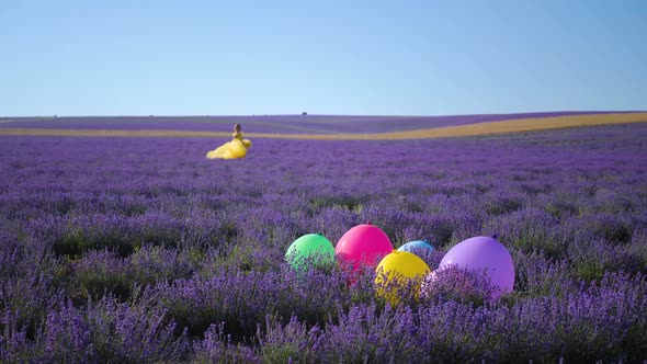 Woman in a Yellow Dress Runs Through a Lavender Field alt