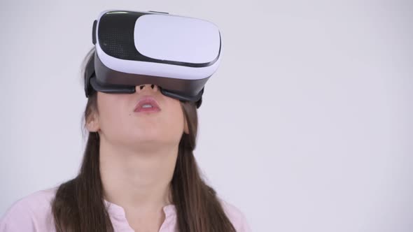 Face of Young Multi-ethnic Businesswoman Using Virtual Reality Headset alt