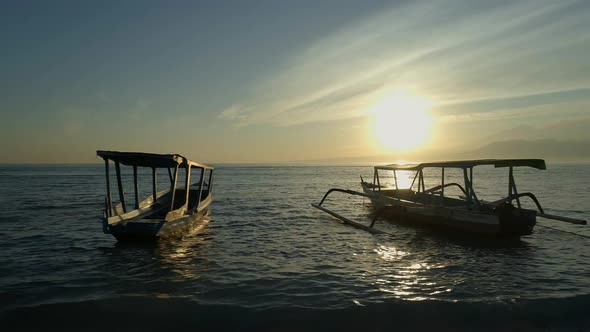 Fishing and Tour Boats Moored to a Shore During Sunrise alt