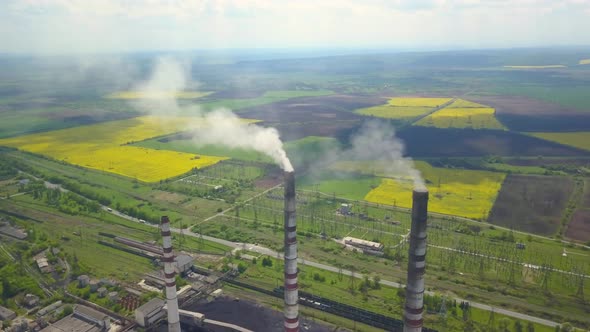 Chimneys of a Thermal Power Plant. Shooting From the Height of an Energy Object Running on Fossil