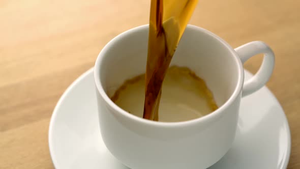 Coffee over-spilled in cup, Slow Motion alt