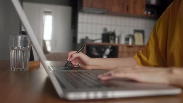 A Retoucher Girl Working at Home Editing Photos alt