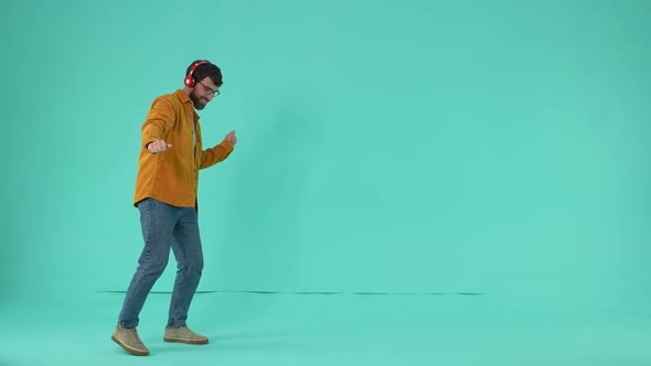 Bearded Man Wearing Headphones Dancing to Music alt