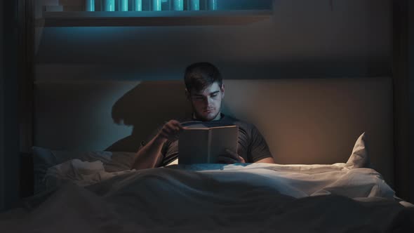 Bed Reading Night Fatigue Tired Man Closing Book alt