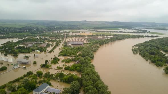 Aerial view of flooded houses with dirty water of Dnister river in Halych town, western Ukraine. alt