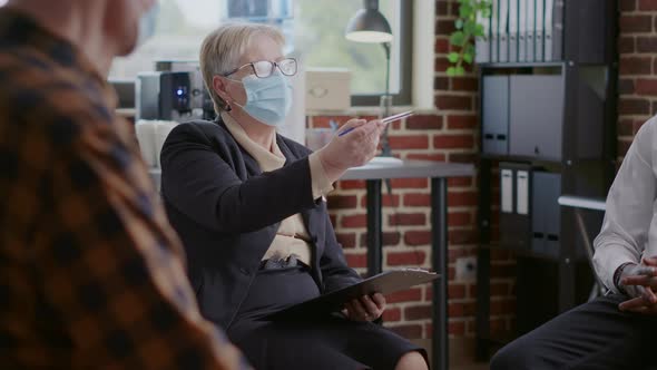 Woman Psychiatrist Having Conversation with People at Aa Meeting During Covid 19 Pandemic alt