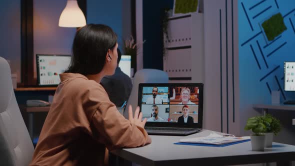 Overworked Manager Working in Startup Business Office Discussing with Virtual Teamwork alt