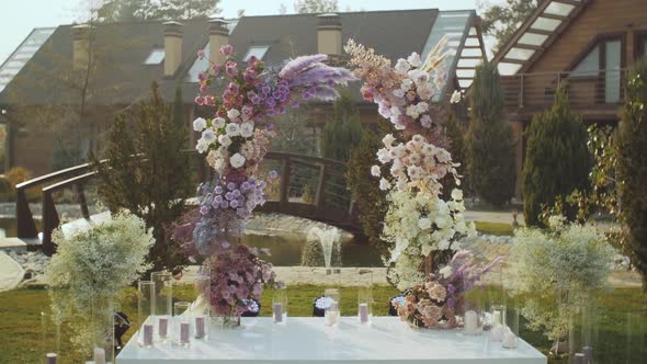 View of Wedding Floral Decorations of Flowers in Pastel Faded Colors Slow Motion Outside Wedding alt