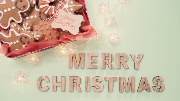 Wood Merry Christmas sign and traditional gingerbread cookies home made. alt