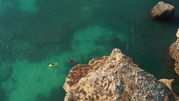People Kayaking in Atlantic Ocean at Ponta De Piedade Portugal Lagos Europe alt