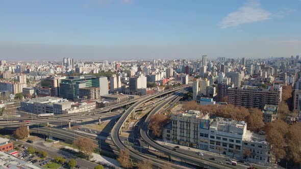 Aerial view of a intersection of Paseo del Bajo and Buenos Aires-La Plata highways at daytime with s alt