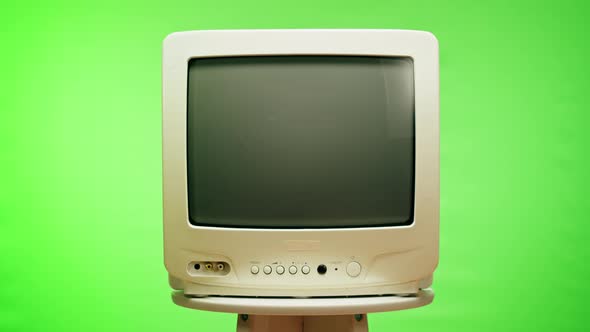 Turning Off Old Television with Grey Interference Screen on Chroma Green Background alt