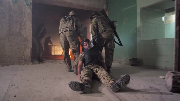 Soldiers Dragging Wounded Away From Battlefield alt