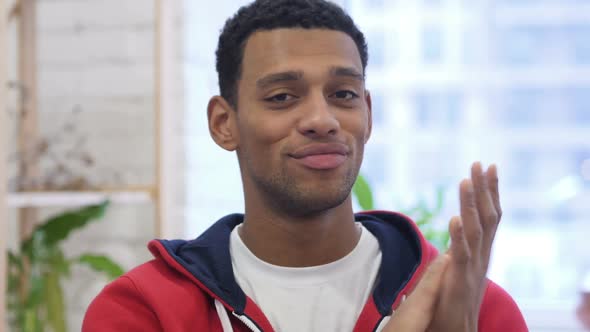 Portrait of Applauding Handsome AfroAmerican Man Clapping alt
