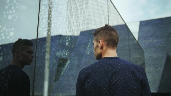 Well-Dressed Entrepreneur businessman Young Attractive Trendy Man looking into his own reflection on alt