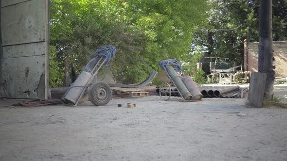 Camera Approaches To Gas Tanks Standing Outdoors on Sunny Production Site. Containers for Gas alt