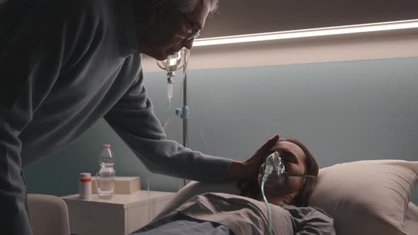 Loving father assisting her sick daughter at the hospital