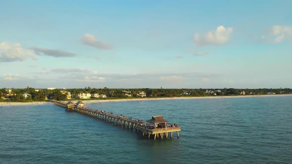 Tourists Watch Sunset From the Pier, Aerial View.