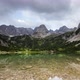 Time Lapse Clouds and Sunrays Move over Mountain Lake in Austrian Alps - VideoHive Item for Sale