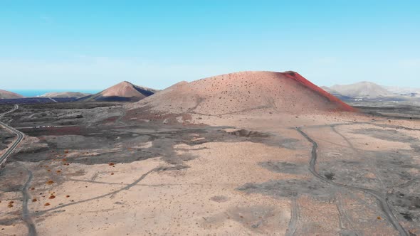 Approaching in Air to Large Crater on Lanzarote Island Canaries alt