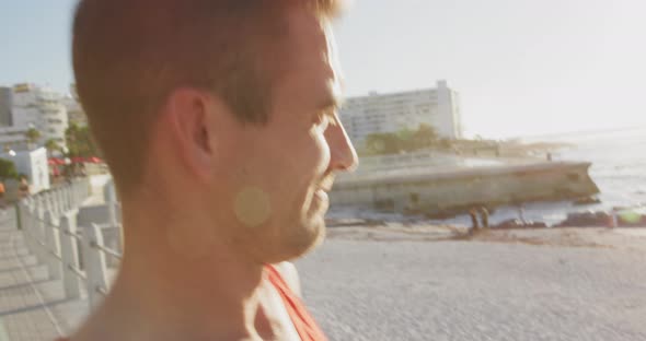 Young man exercising by the sea alt