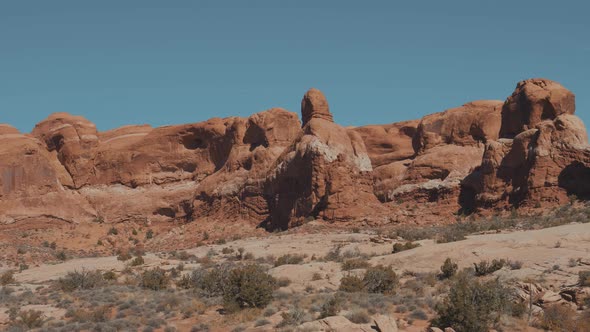 Red Orange Massive Smooth Rock Formation In Arches Park On Sunny Day In Motion alt